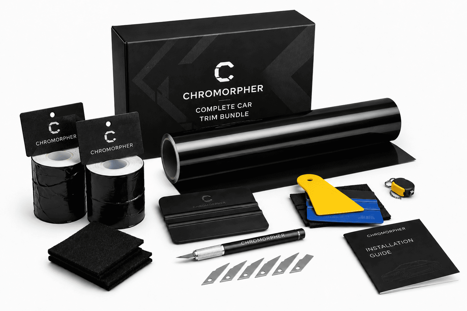Chromorpher Complete Car Trim Bundle kit with black vinyl film rolls, a large black trim roll, installation tools, a pen, blade tips, a yellow-and-blue squeegee, an instruction booklet, and branded packaging on a white background.