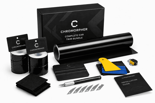 Chromorpher Complete Car Trim Bundle kit with black vinyl film rolls, a large black trim roll, installation tools, a pen, blade tips, a yellow-and-blue squeegee, an instruction booklet, and branded packaging on a white background.