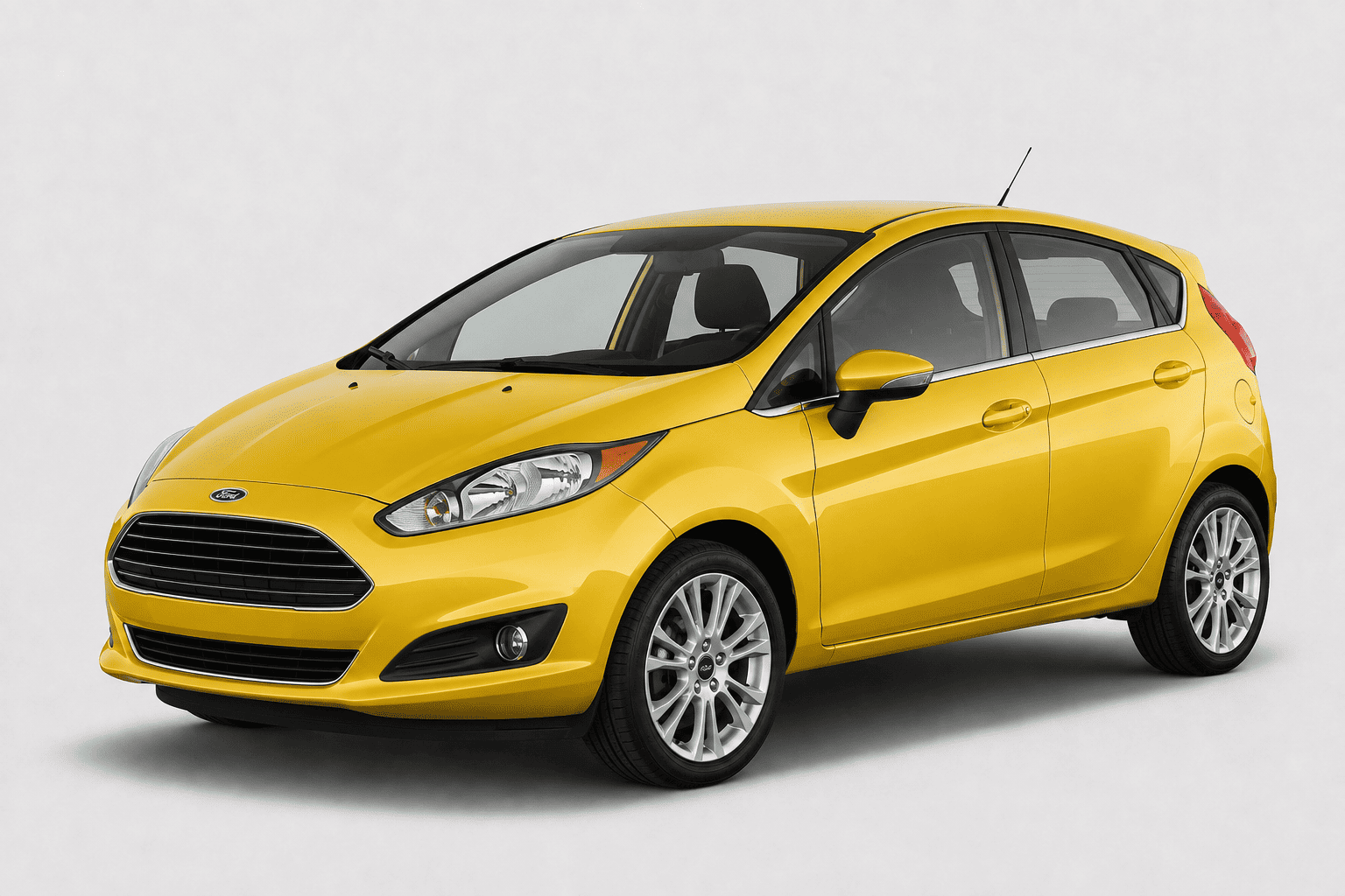 A bright yellow Ford Fiesta hatchback car shown from a three-quarter front angle on a light gray studio background.