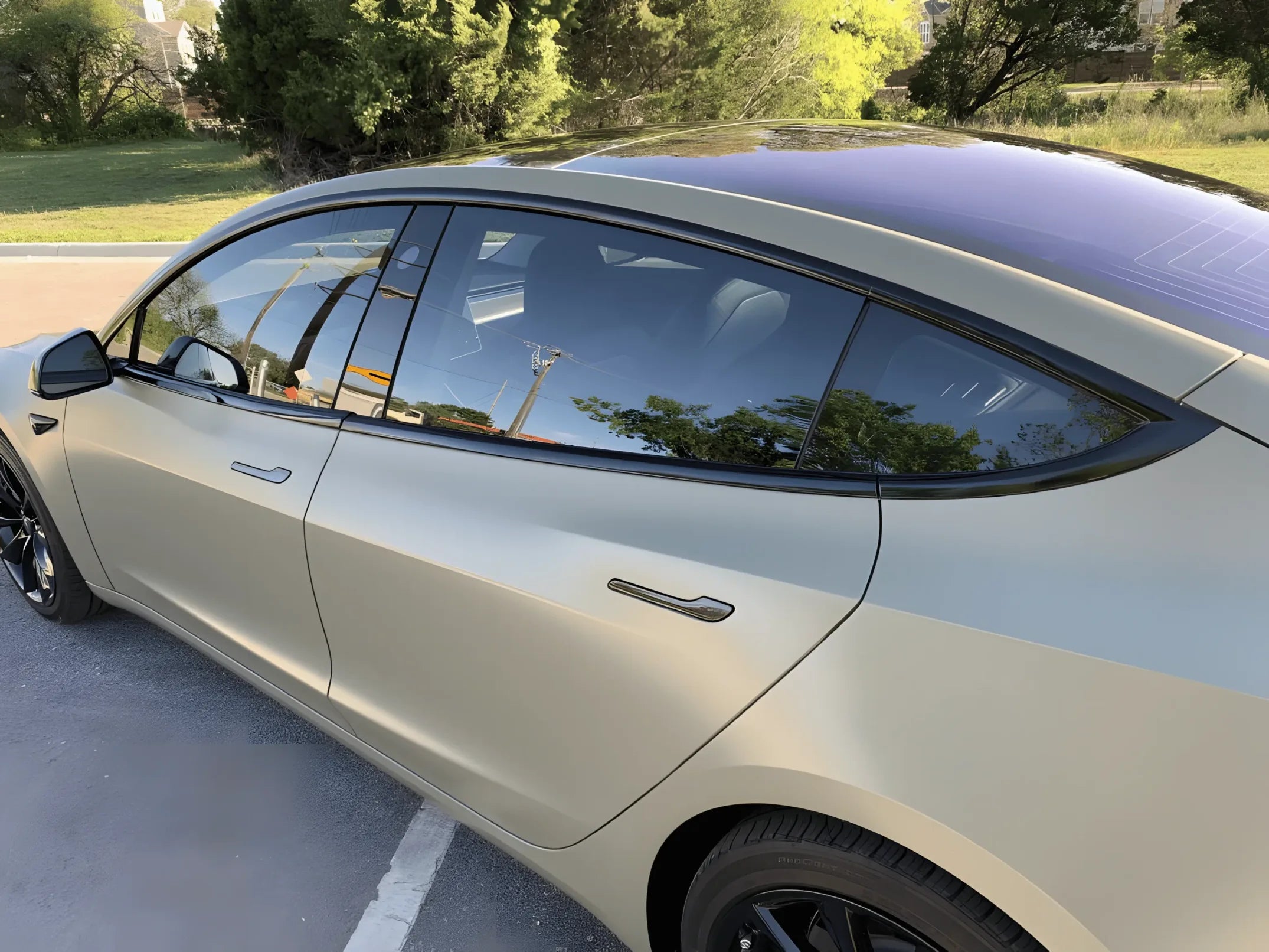 Tesla Model 3 with blacked-out window trim and door handles using ChroMorpher Glossy Chrome Delete Tape.