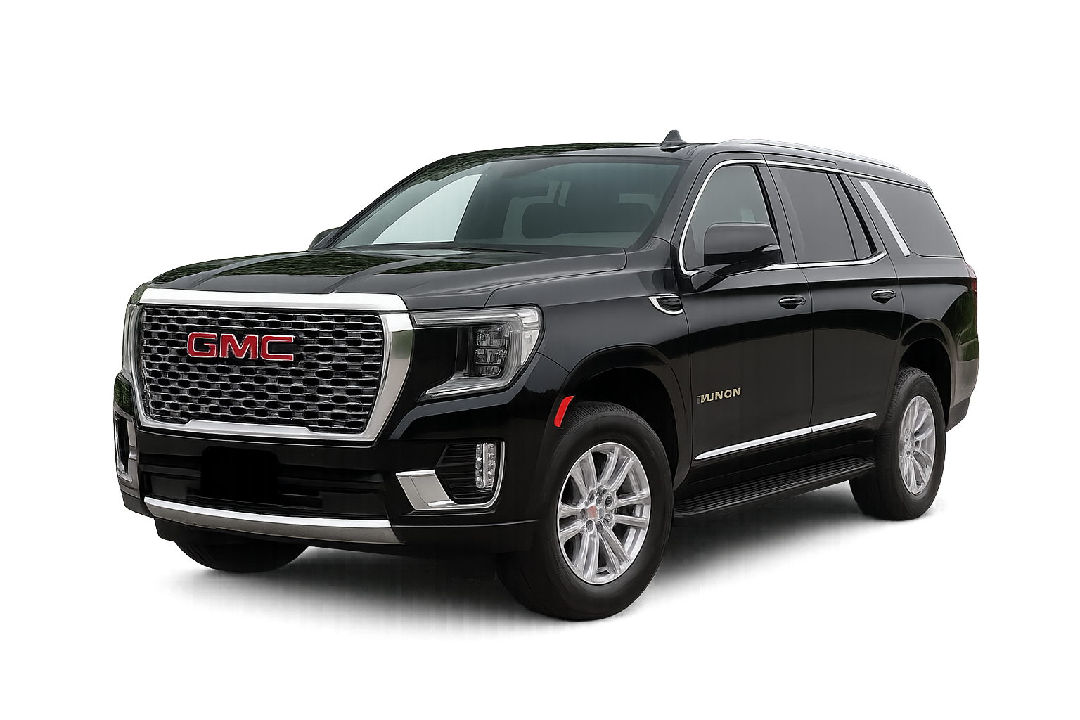GMC Yukon SUV featuring chrome accents and a glossy black finish, with a bold front grille and silver wheels highlighting its premium design.