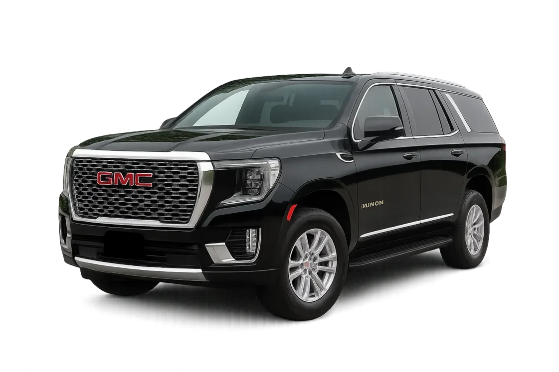 GMC Yukon SUV featuring chrome accents and a glossy black finish, with a bold front grille and silver wheels highlighting its premium design.
