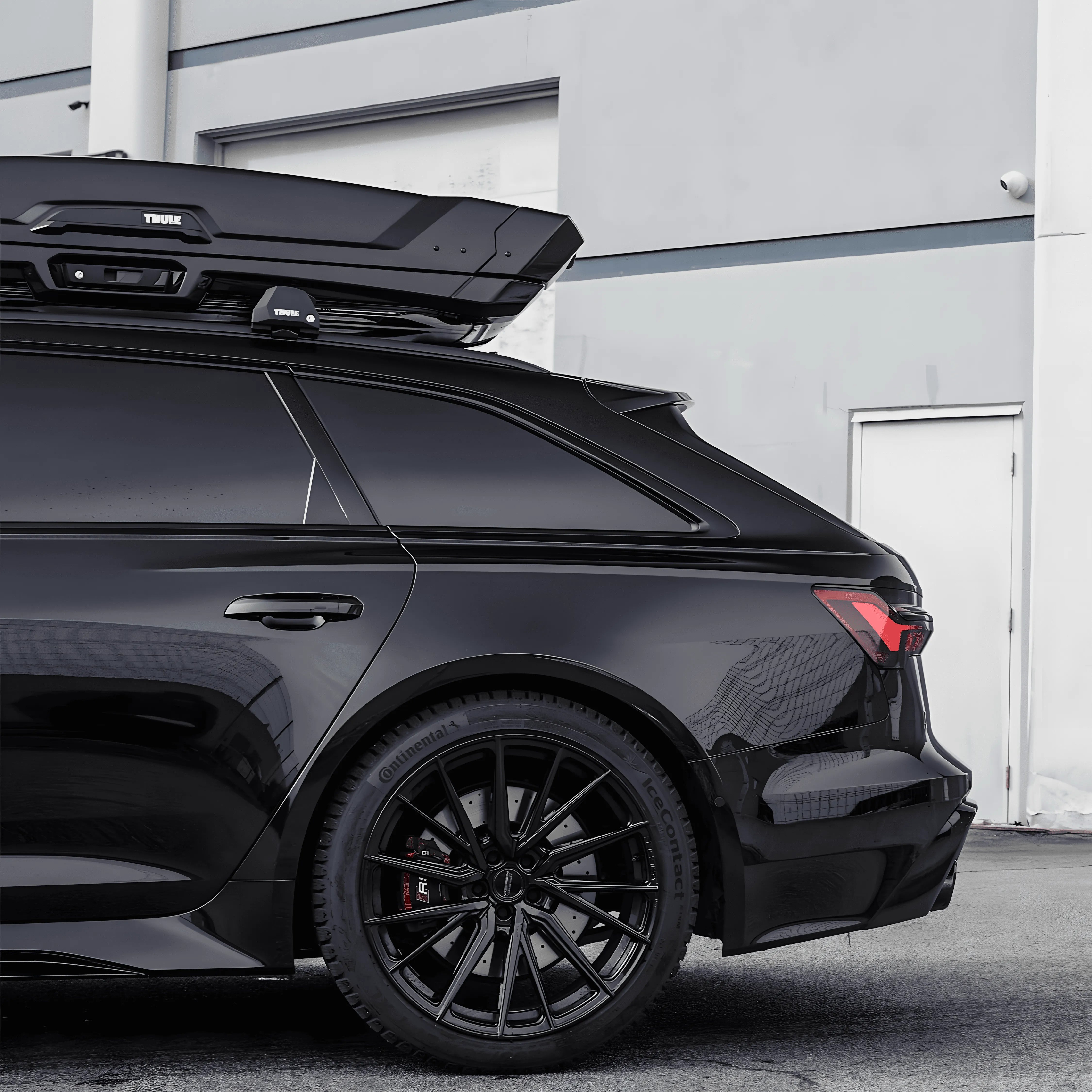 Audi wagon with full chrome delete using ChroMorpher Glossy Black Chrome Delete Tape, featuring blacked-out window trim and wheels.