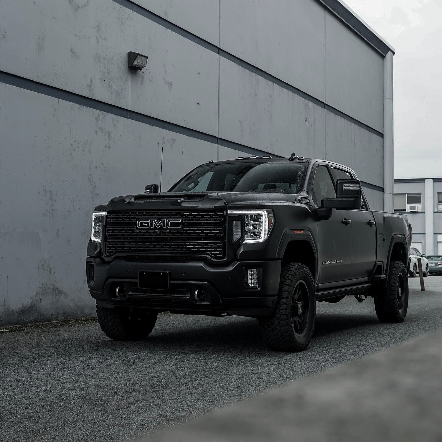 GMC truck showcasing the new arrivals of enhanced chrome delete extra protection tape with a carbon fiber finish, perfect for a durable and sleek vehicle transformation.