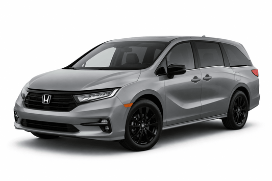 A silver Honda Odyssey minivan with black wheels, shown from a three-quarter front angle on a white studio background.