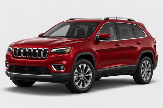 A red Jeep Cherokee SUV shown from a three-quarter front angle on a light gray studio background.