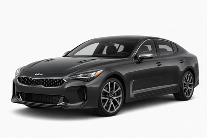 A dark gray Kia Stinger sedan shown from a three-quarter front angle on a clean, light gray studio background.