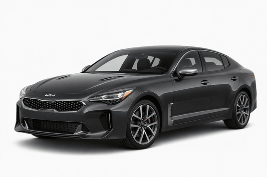 A dark gray Kia Stinger sedan shown from a three-quarter front angle on a clean, light gray studio background.