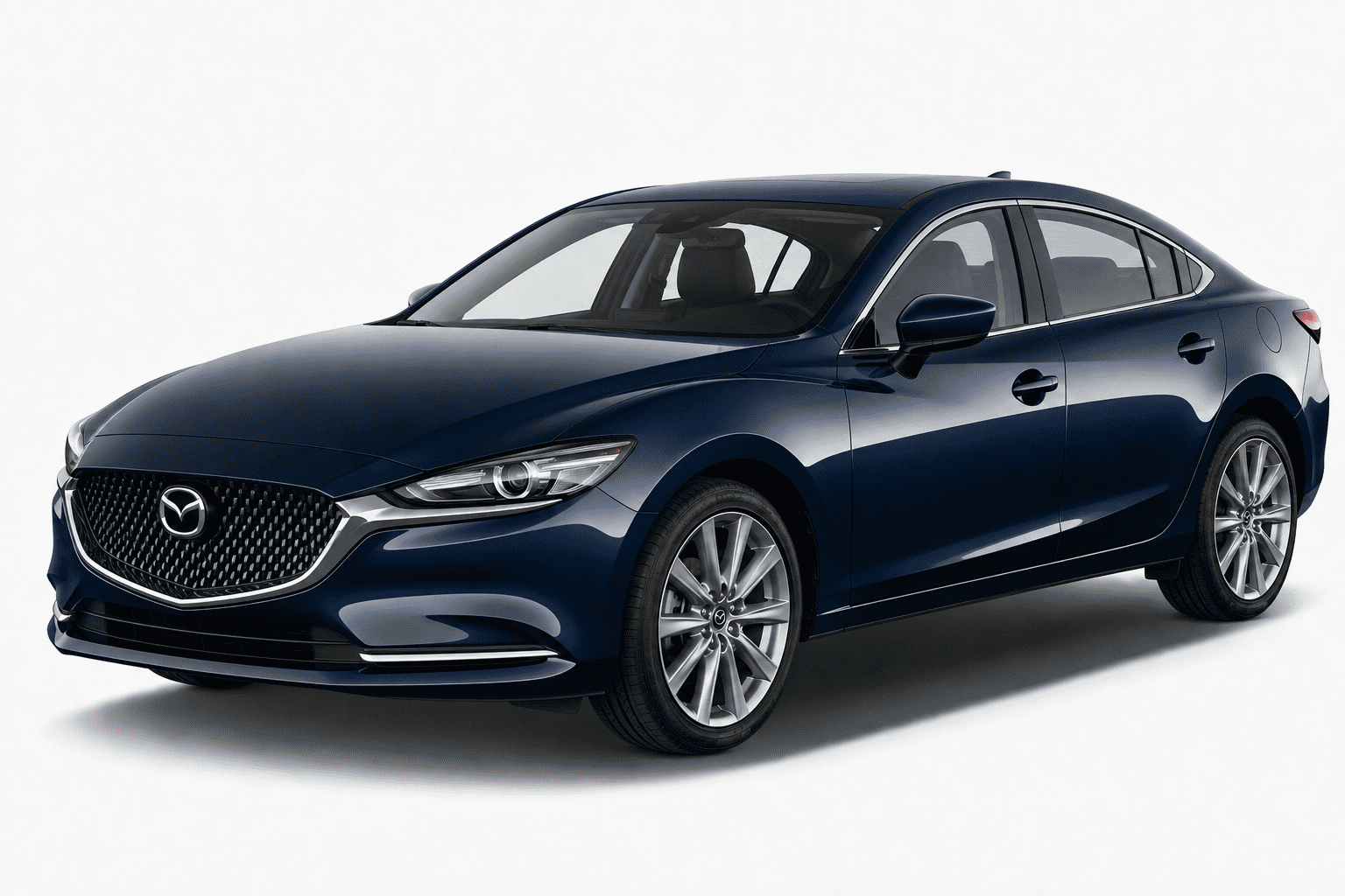 A dark blue Mazda sedan photographed in a clean studio setting with a light gray background. The front grille and Mazda emblem are visible, along with the side and rear quarter panels, alloy wheels, and tinted windows.