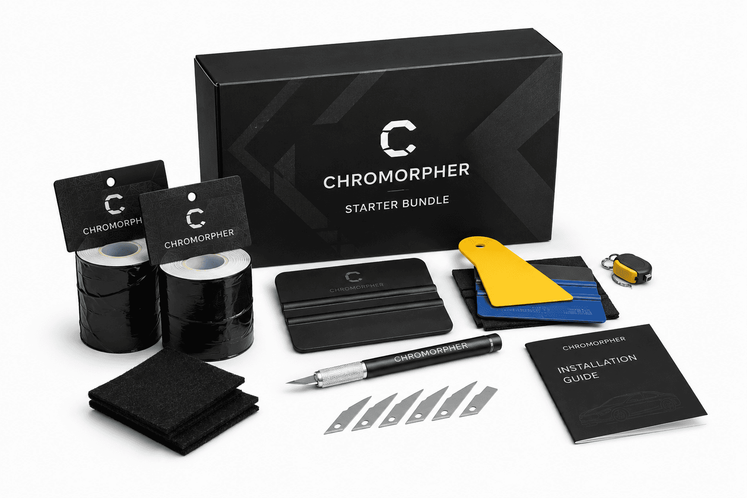 Chromorpher starter bundle kit on a white background, including a black branded box, black tape rolls, a black pen, metal blades, a yellow and blue card, a small yellow-and-black tool, and an instruction guide.