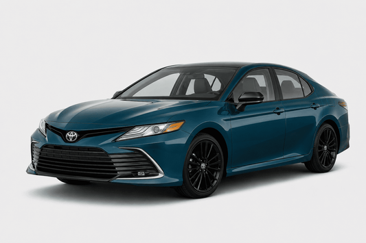 A dark teal blue Toyota Camry sedan with black wheels, shown from a three-quarter front angle on a light gray studio background.