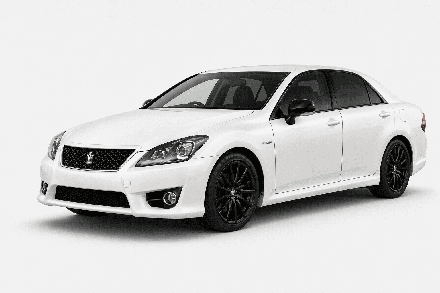 A white Toyota sedan with black multi-spoke wheels, shown from a three-quarter front angle on a light gray studio background.