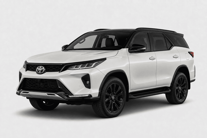 A white Toyota Fortuner SUV with black accents, including the roof, wheels, and trim, shown from a three-quarter front angle on a light gray background.