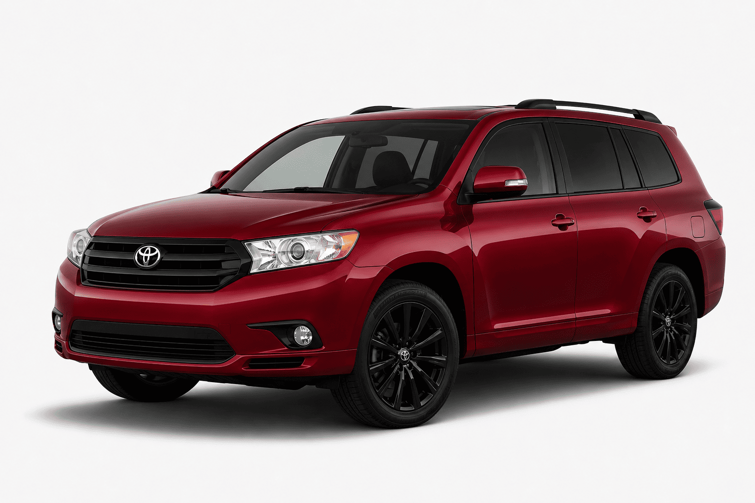 A red Toyota Highlander SUV with black wheels and roof rails, photographed from a three-quarter front angle on a light gray studio background.