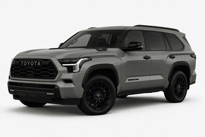 A gray Toyota Highlander SUV with black wheels and trim, shown from a three-quarter front angle on a light gray studio background.