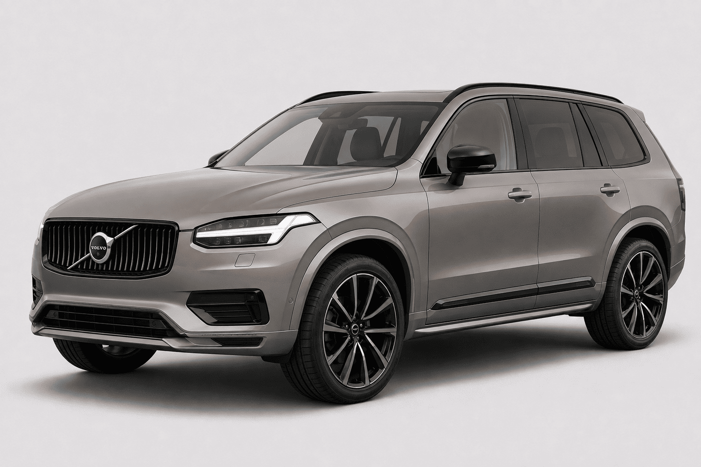 A silver Volvo SUV photographed at a three-quarter front angle on a clean light gray studio background.