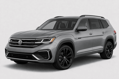 A silver Volkswagen Atlas SUV with black wheels and roof rails, photographed from a three-quarter front angle against a light gray studio background.