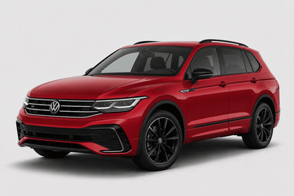 A red Volkswagen SUV with black wheels and trim, photographed from a three-quarter front angle on a light gray studio background.
