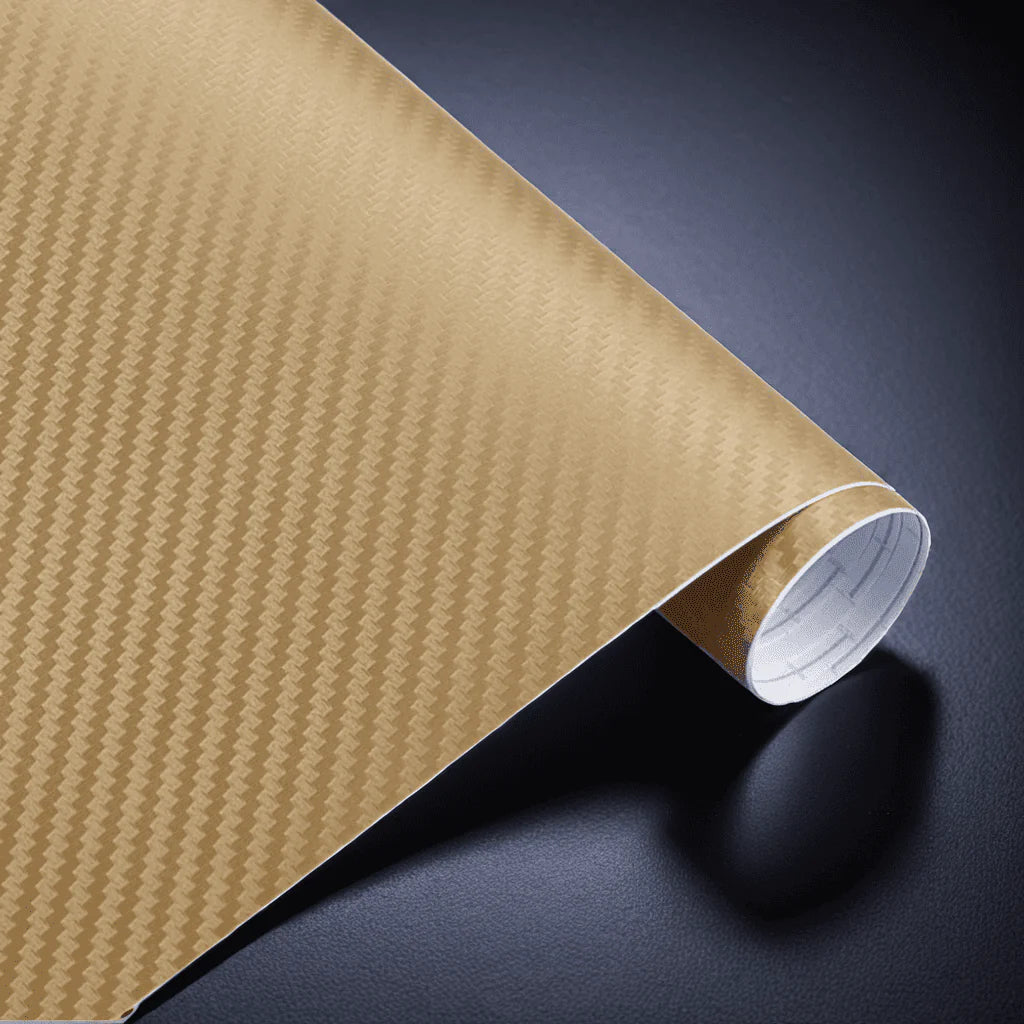 A roll of ChroMorpher carbon fiber vinyl in gold, featuring a detailed 3D carbon fiber texture, perfect for sleek and durable customization of vehicles and other surfaces.
