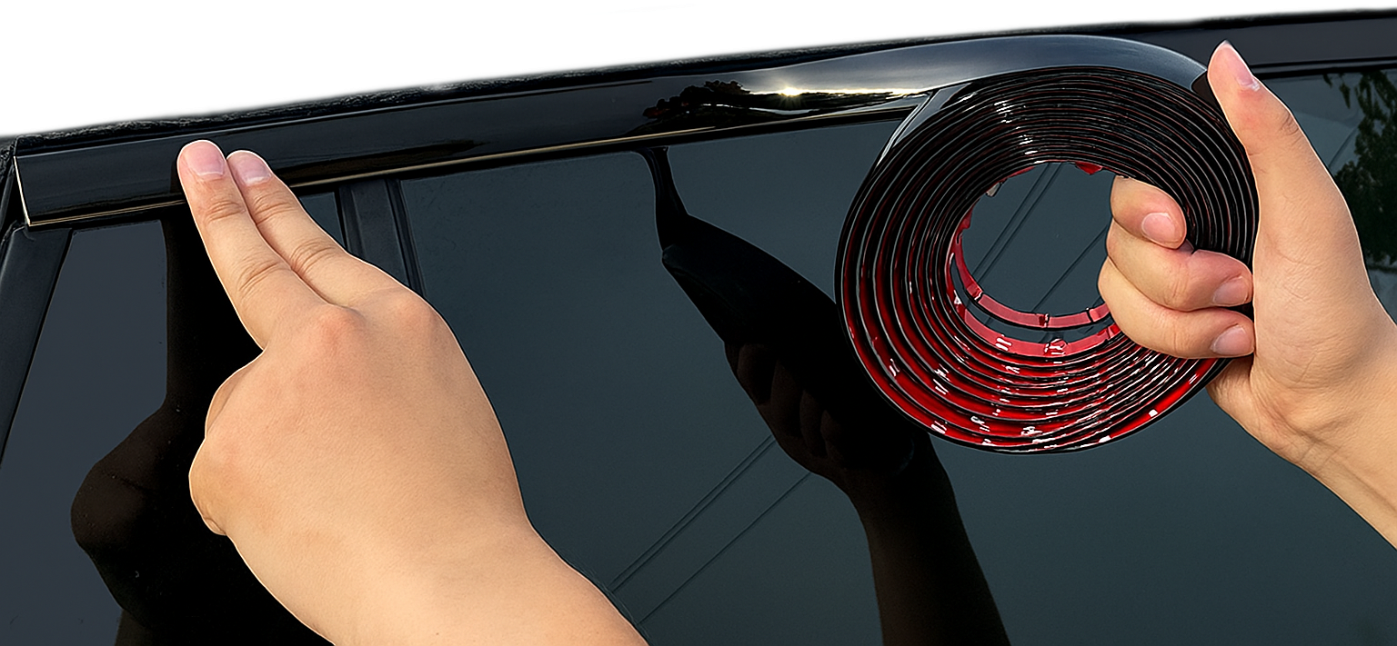 Two technicians working on a sleek black BMW M4 in a specialized garage, focusing on detailing and modification work.